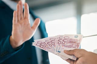 Money, euros and hand of a businessman saying stop fraud, corruption and money laundering in the corporate industry. Finance, bribery and person rejecting a cash or financial payment trade deal