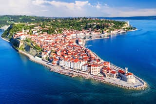 Piran, Slovenia. Beautiful aerial view on Piran town, ancient buildings with red roofs and Adriatic sea in southwestern Slovenia