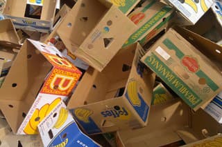 "Gera, Germany - September 29, 2012: empty banana cardboard boxes on a pile. Rest of a fleamarket. In this boxes were books for a fleamarket and now they are empty and on a pile for waste."