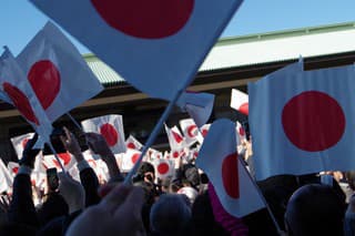Tokyo, Japan – January 2, 2019: In Japan, New Year's celebration ceremony will be held at the Imperial Palace in New Year. That day is January 2.Many citizens gather there and celebrate with the Emperor and the Royal Family. People will shake a lot of national flags and pray for happiness. Current Emperor retires April 30, 2019. On May 1, the Crown Prince attends the Emperor. ‘Heisei’ of the Japanese era will change to a new era.