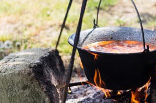 Gulyas stew boiling in a cauldron