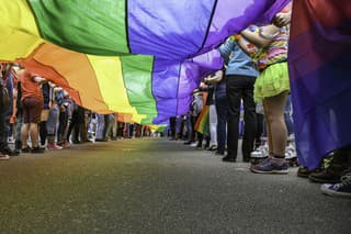 Under a LGBT Pride Flag, taken at Exeter Pride Parade, public event.