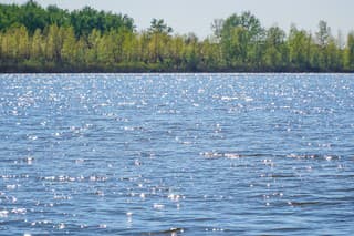 Large lake or river in good Sunny weather. The ripples on the water