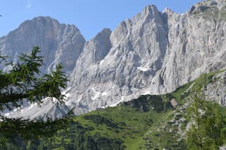 The stunning Dachstein mountain range in Austria on a clear sunny day.