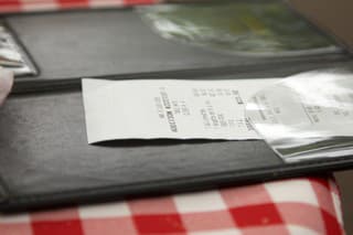 Restaurant check on patterned cloth