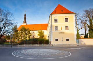 Trnava, Slovakia - March 31, 2016: Western Slovak Museum in Trnava in western Slovakia. Tower of a church can be seen behind the building.