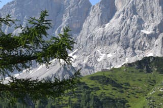 The stunning Dachstein mountain range in Austria on a clear sunny day.