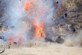 fire and movement of car part blown away from explosion in post blast investigation course training