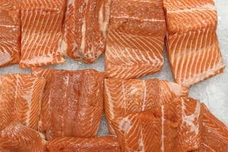 Top view of fresh salmon fillet display for selling in wet market.