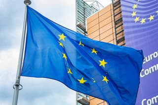 Brussels, Belgium - 21 May, 2022: European Union flag in front of the Berlaymont building, headquarters of European Commission.