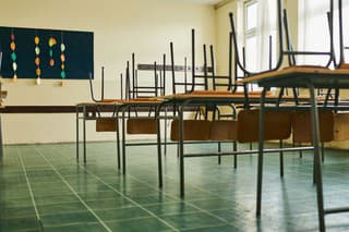 Empty classroom with chairs on the table during COVID-19 pandemic