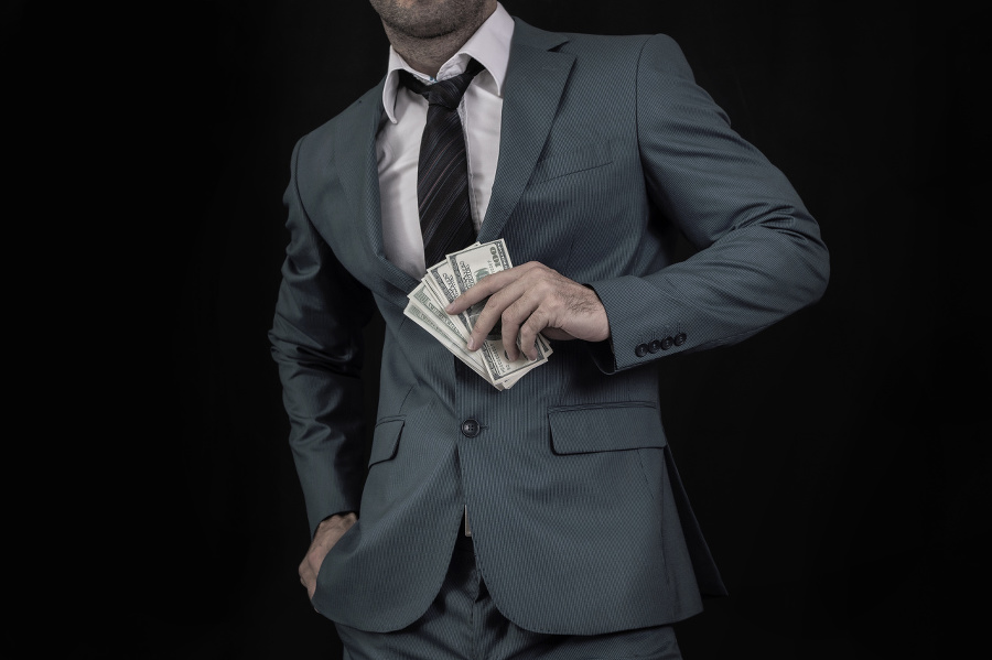 Businessman showing dollar bills