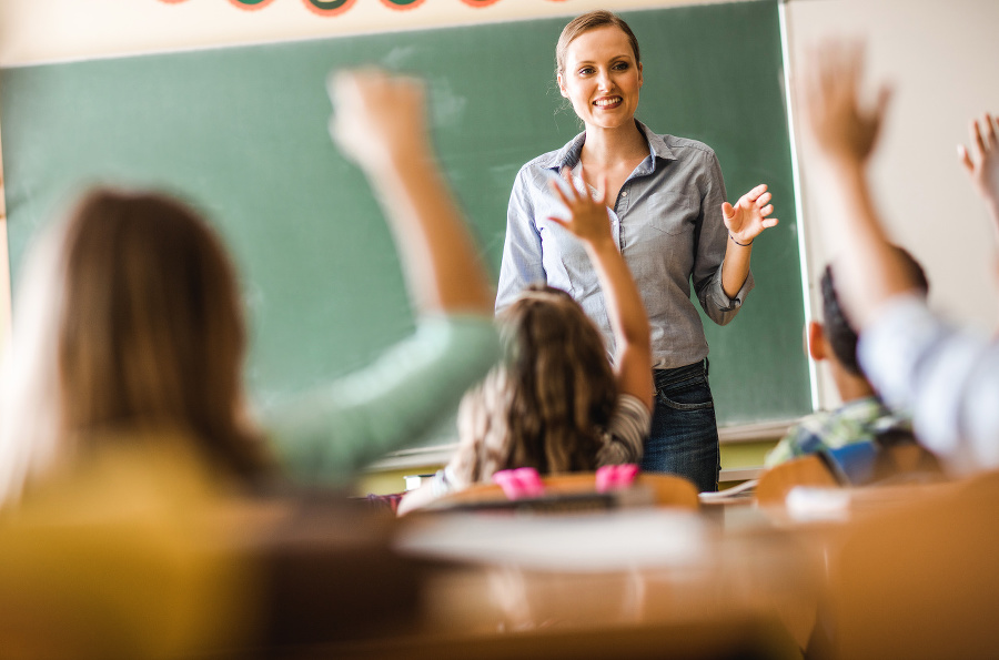 Happy female teacher asked