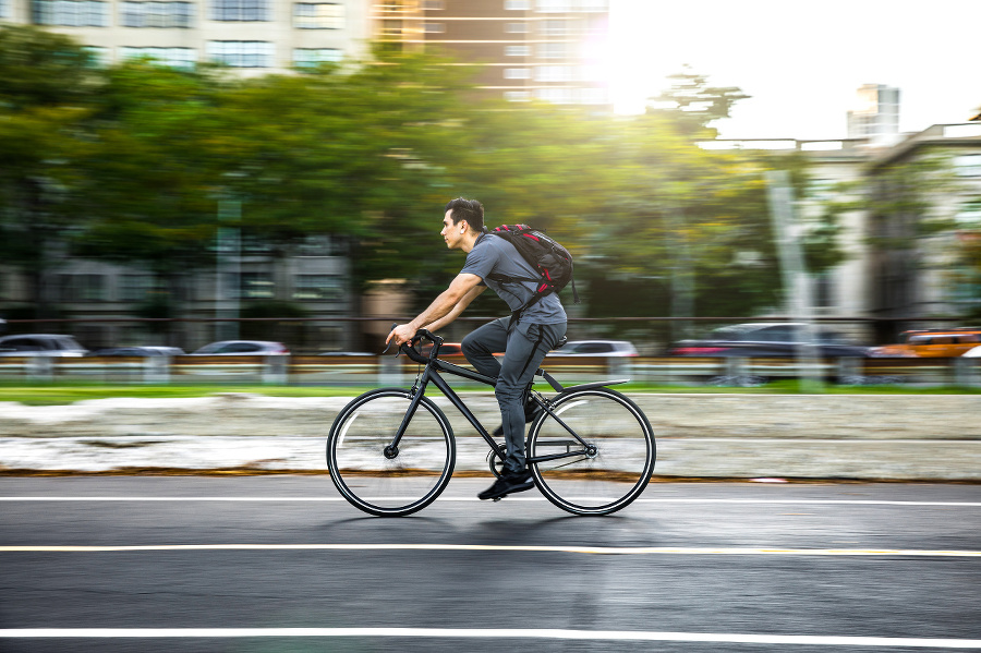 Young man cycling in the city, commuting to work in Chicago - USA.