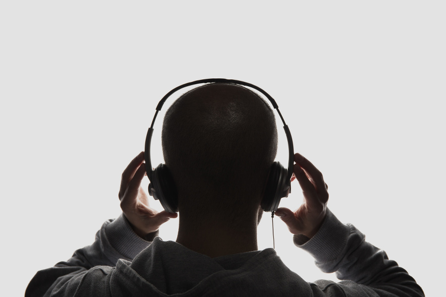 Male silhouette with headphones