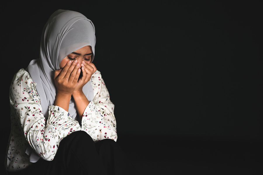 Young Muslim girl sitting