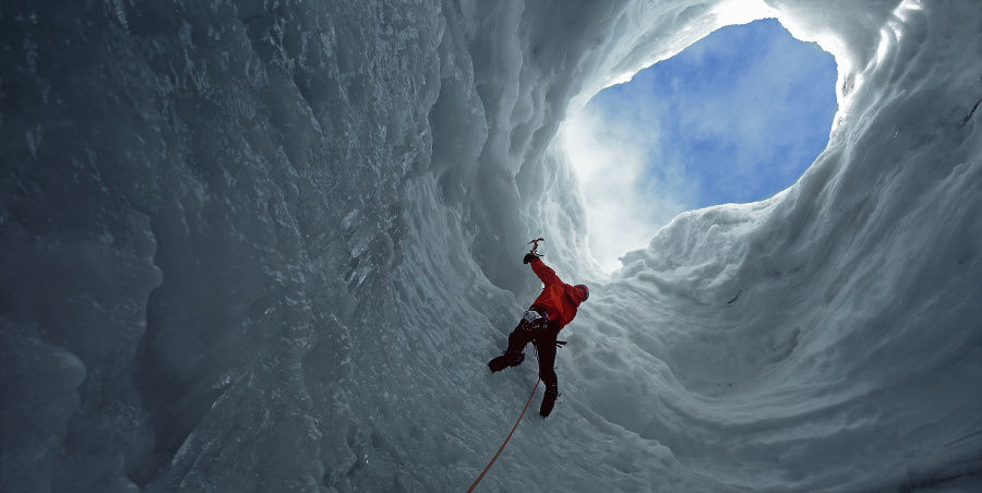 Man climbing glacier with