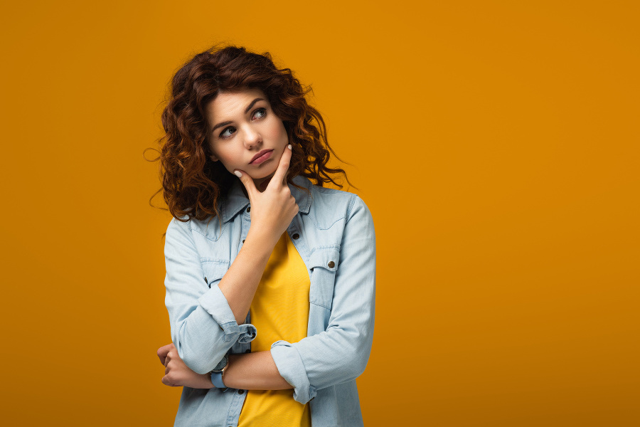 pensive redhead woman thinking