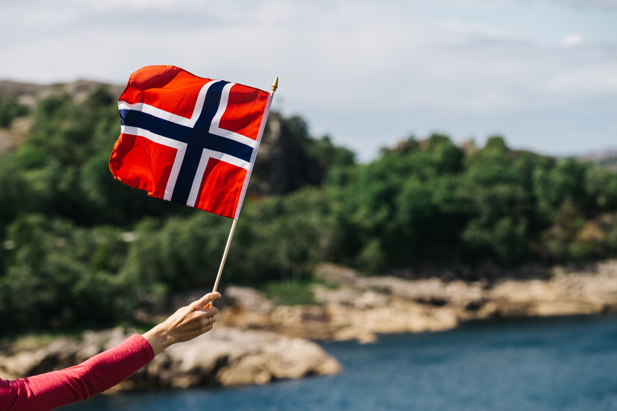 Tourist hand holding norwegian