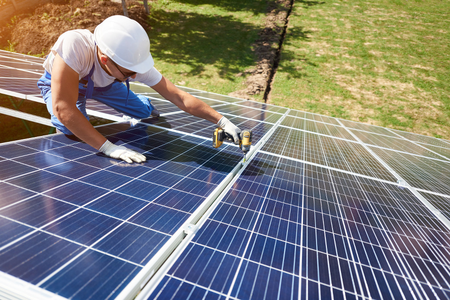Professional worker installing solar