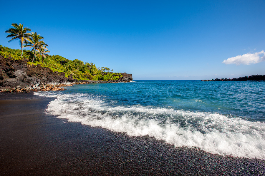 Honokalani Black Sand Beach at Wainapanapa State Park. This beach is set among lava cliffs and the sand is actually small black lava pebbles. Wainapanapa State Park, Maui Island, Hawaii