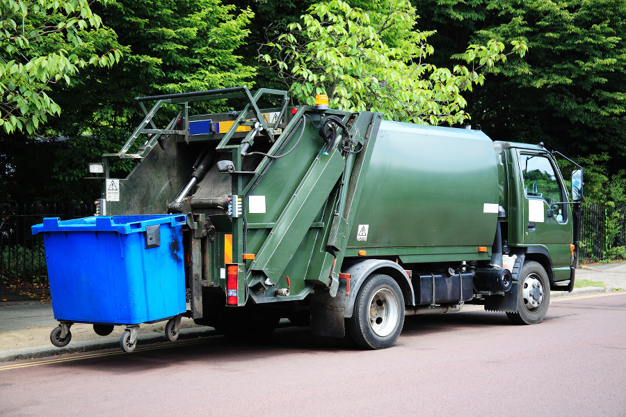 Green garbage truck with