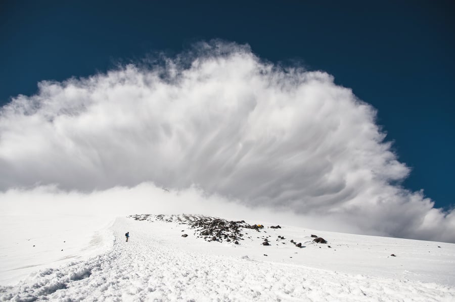 Stormy clouds surging above