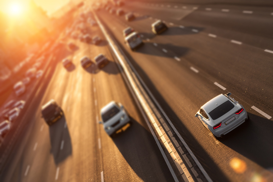 Cars on highway. Sunset