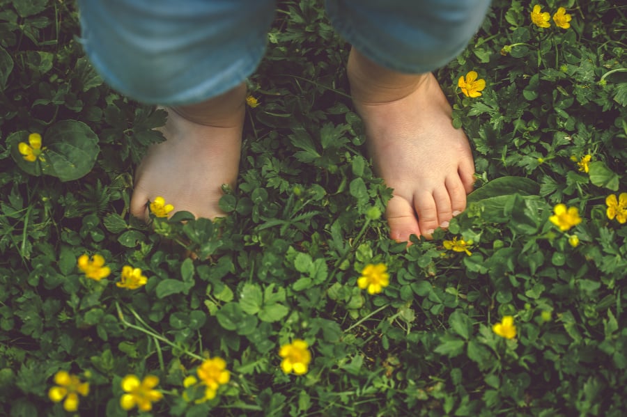 Feet of toddler among