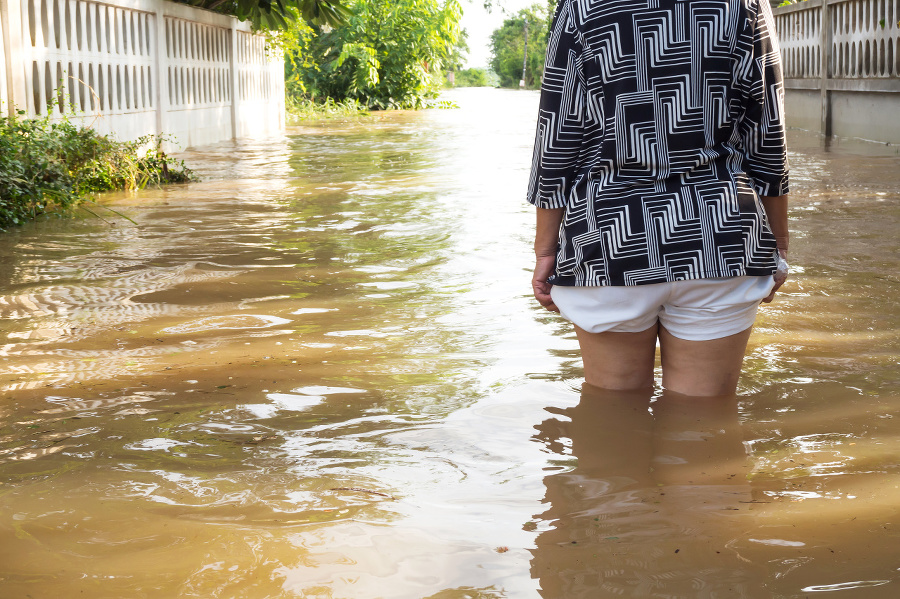 Woman wade flooding in