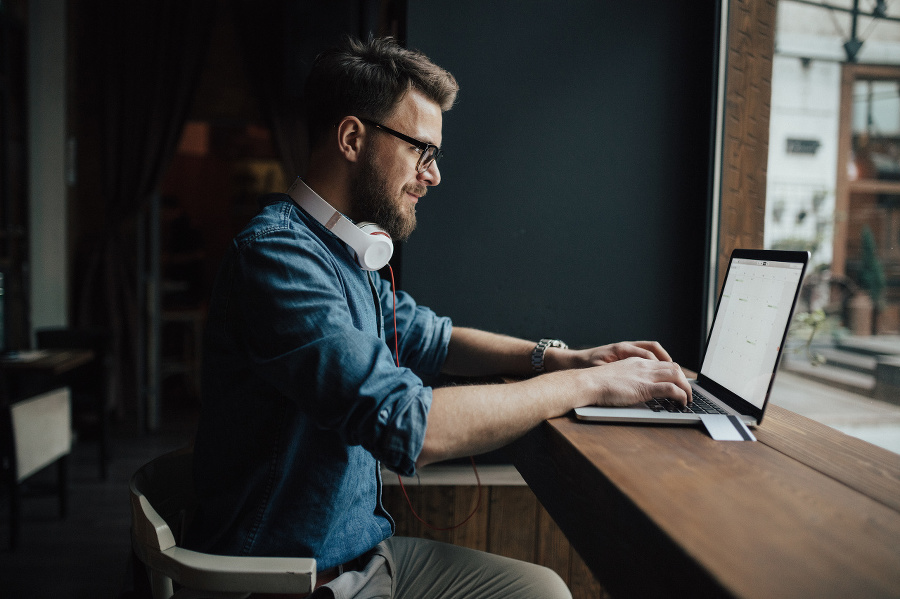 Bearded graphic designer checking