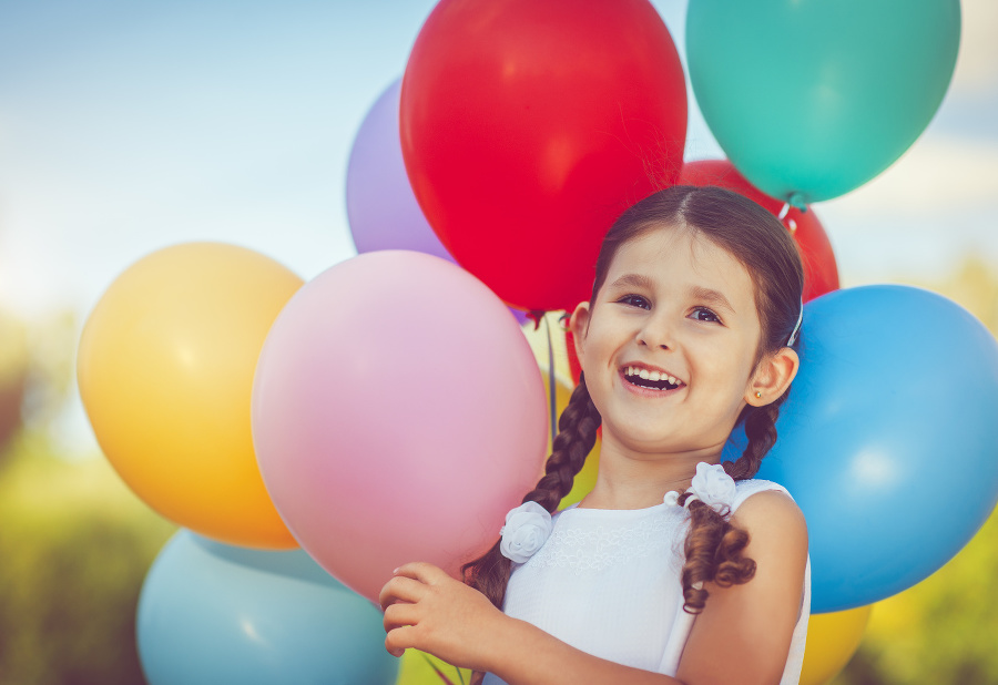 Girl with colorful balloons