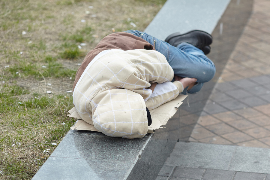 young homeless man sleeping