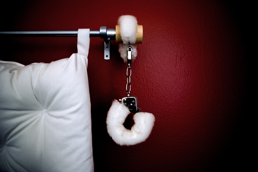 Fluffy white handcuffs hanging