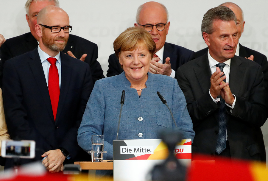 Angela Merkelová oslavuje víťazstvo.
