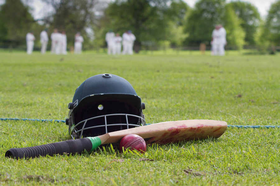 Cricket helmet, bat and