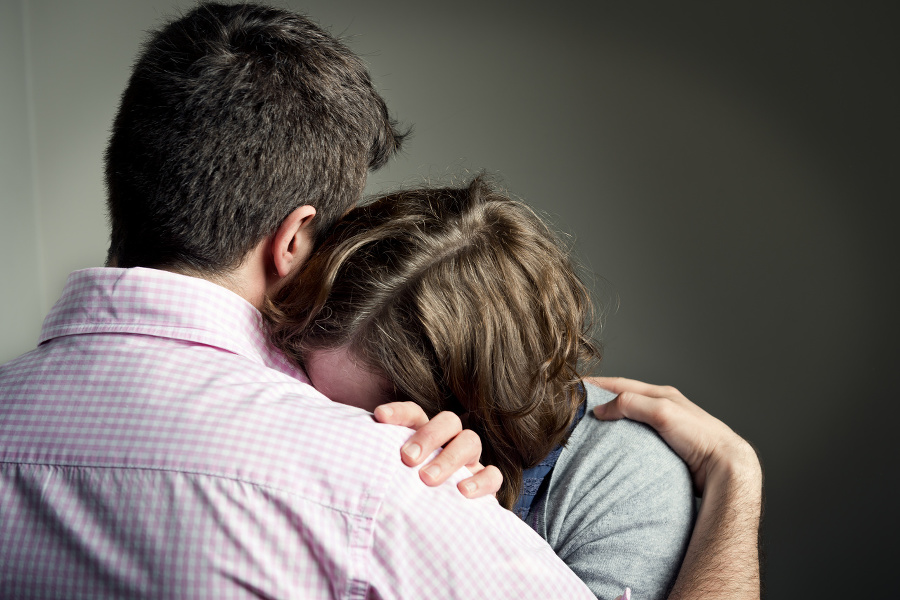 Couple embracing after receiving