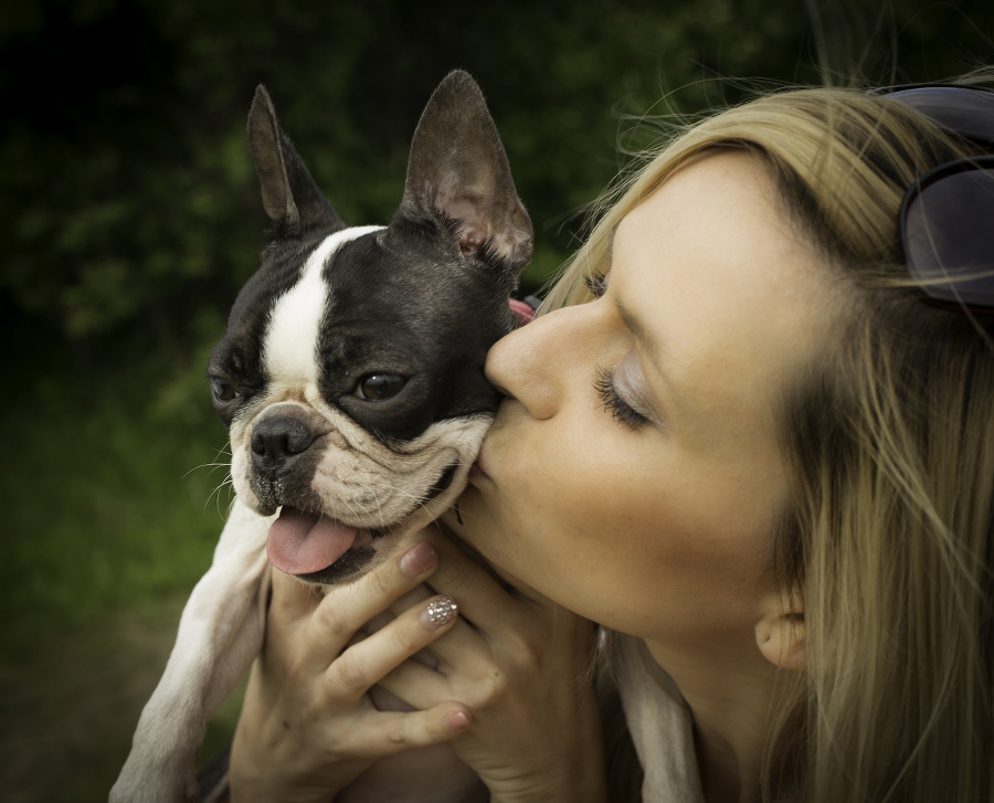 Owner kissing her dog