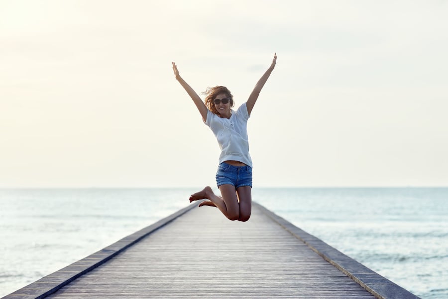 Happy jumping girl on