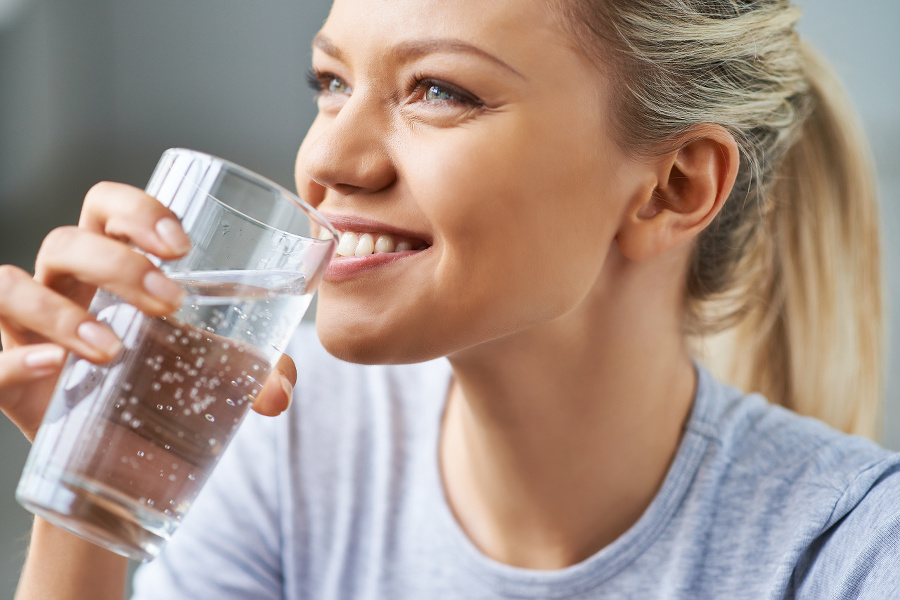 Beautiful young woman drinking