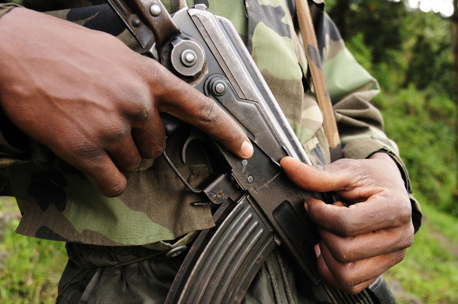 An African soldier grips