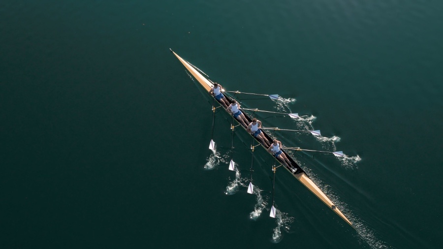 Four male rowers sculling