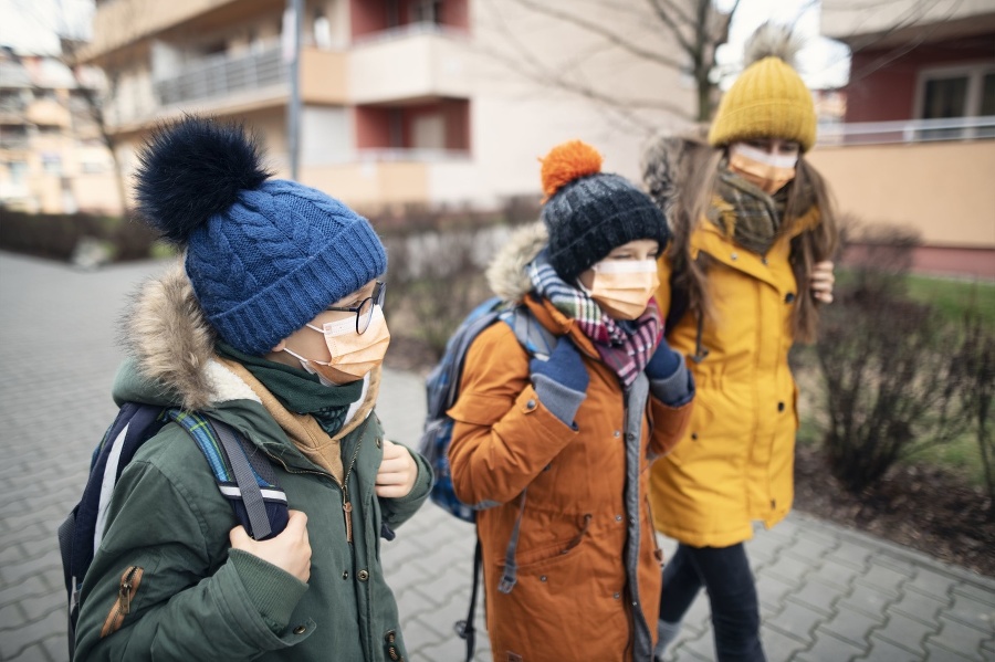 Three kids wearing anti