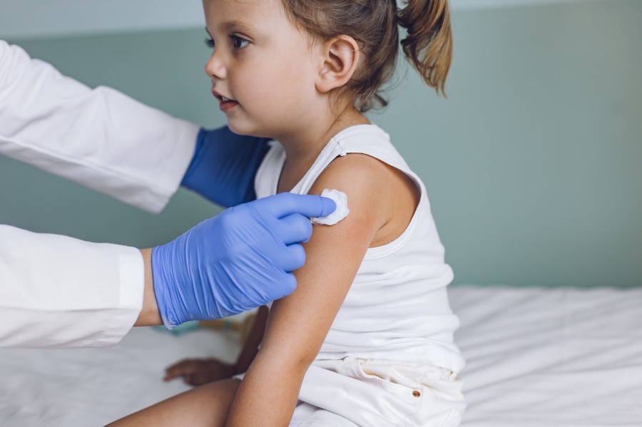 Nurse vaccinating a young