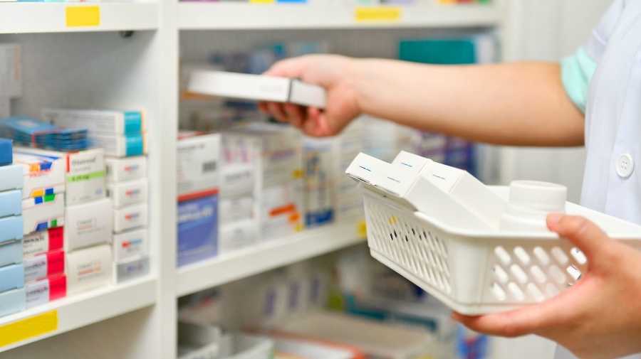 Pharmacist filling prescription in pharmacy drugstore