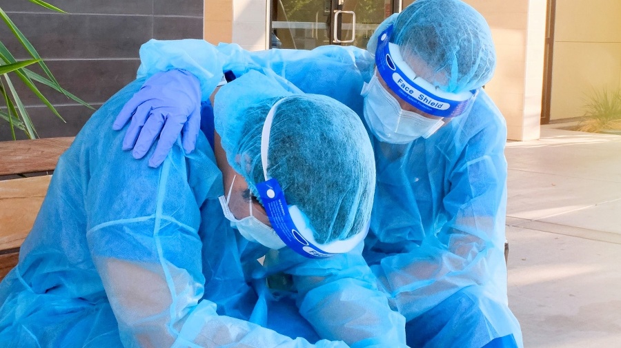 Healthcare worker comforting her