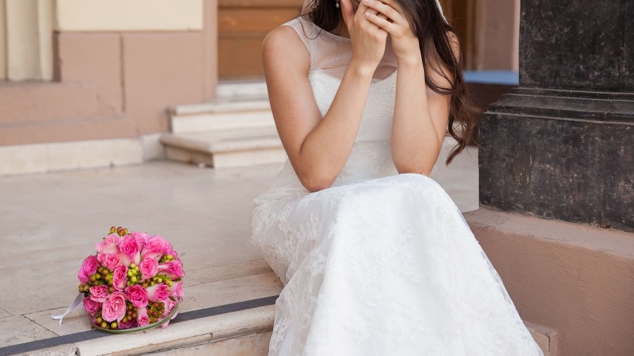Hopeless bride crying outside