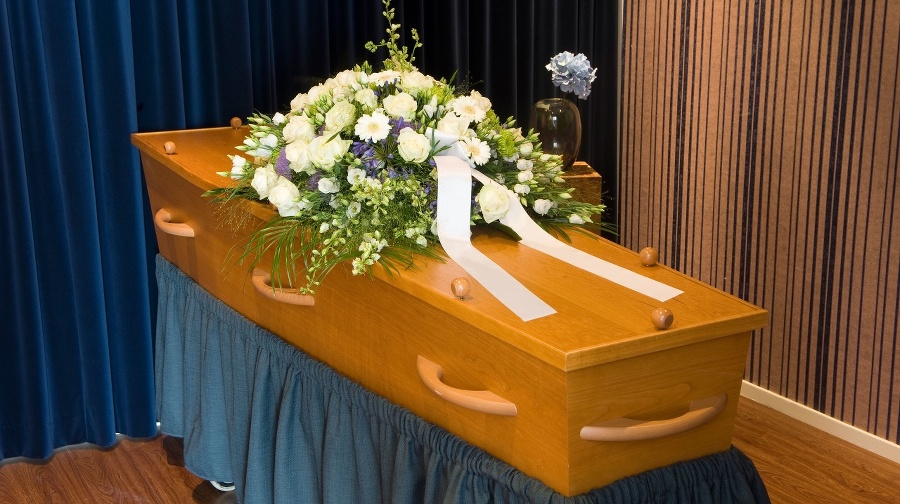 A coffin with flower