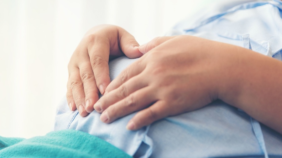 Pregnant woman lying on