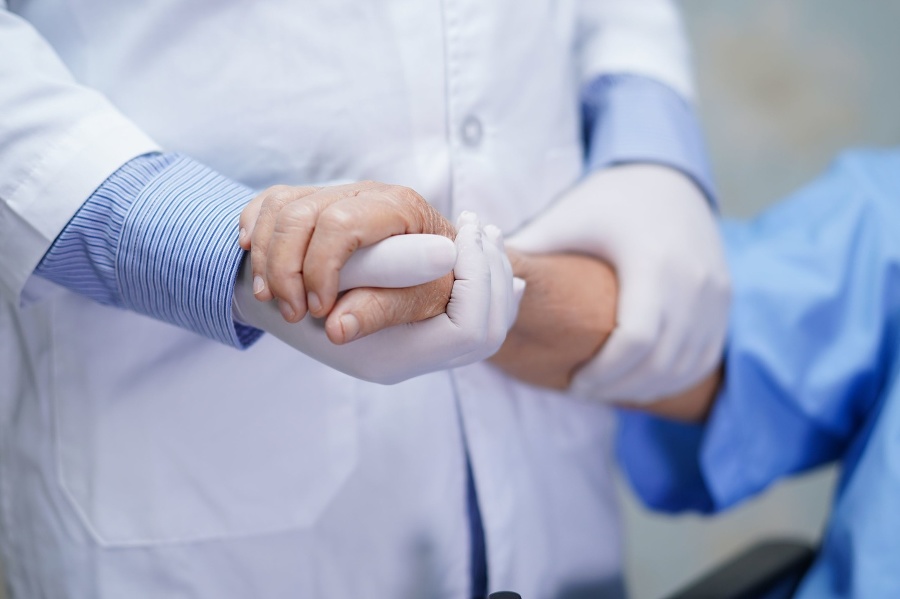 Doctor holding touching hands